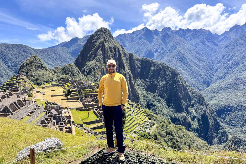 Tourist photo at Machu Picchu with Huayna Picchu in the background