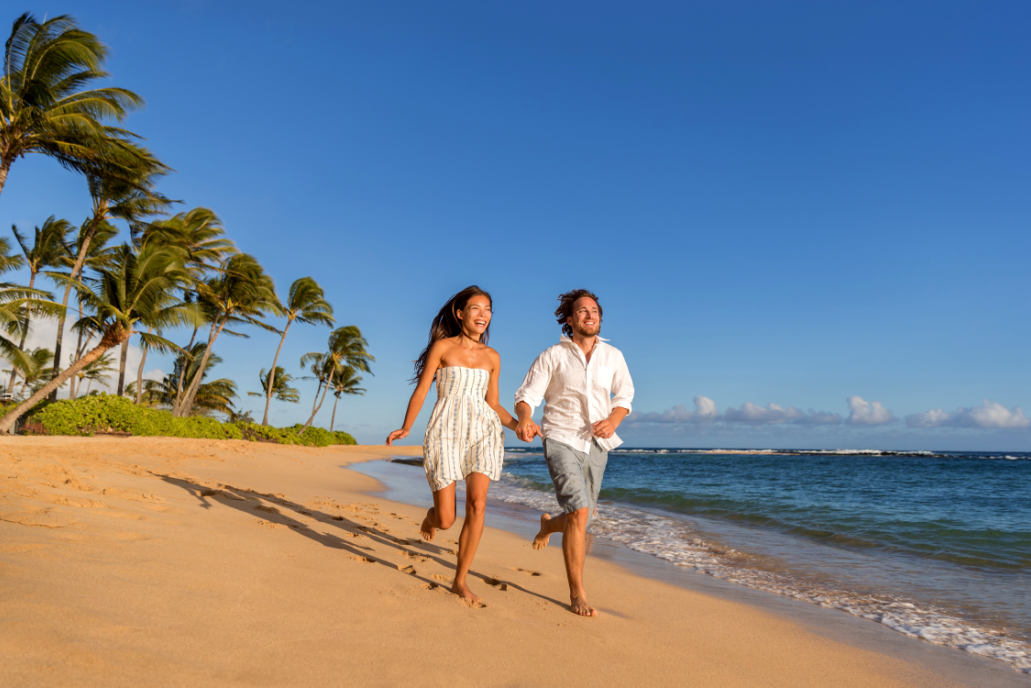 Couple walking along the beach of Mancora